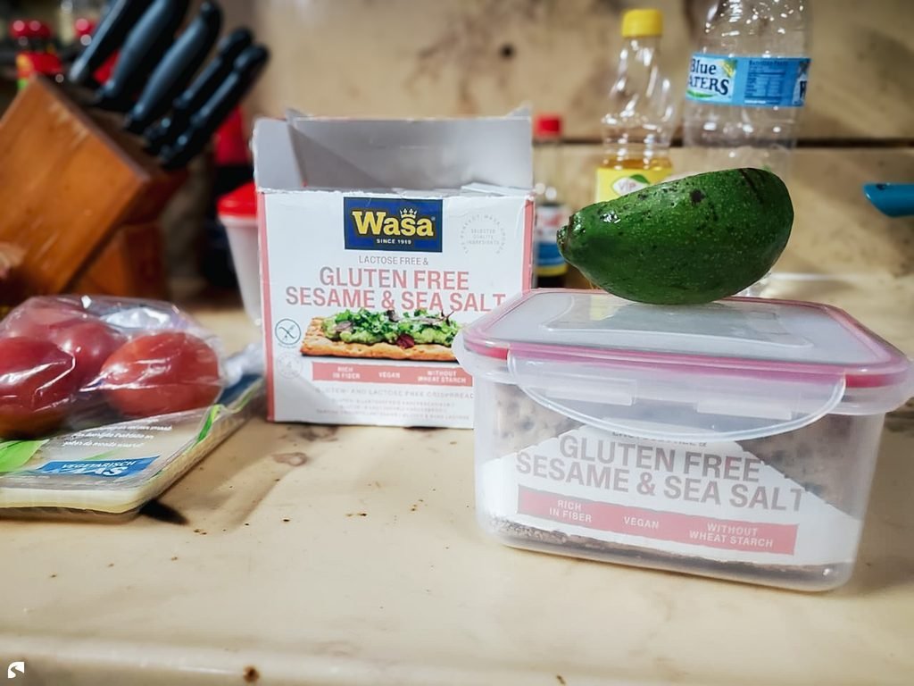 Gluten-free Wasa crackers, avocado and fresh groceries prepared for a gluten-free meal in Suriname.